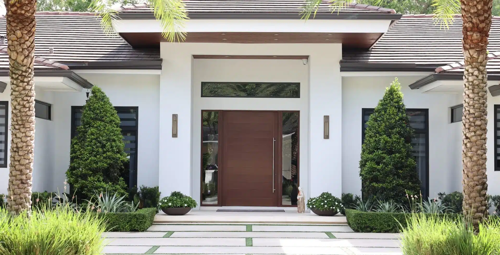 Modern South Florida home with impact-rated pivot entrance door and windows